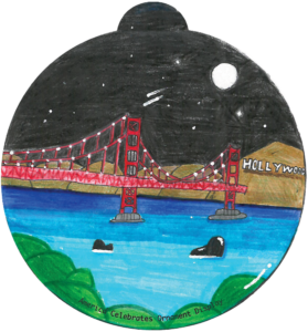 ornament depicting whales in the water below the San Francisco bridge at night