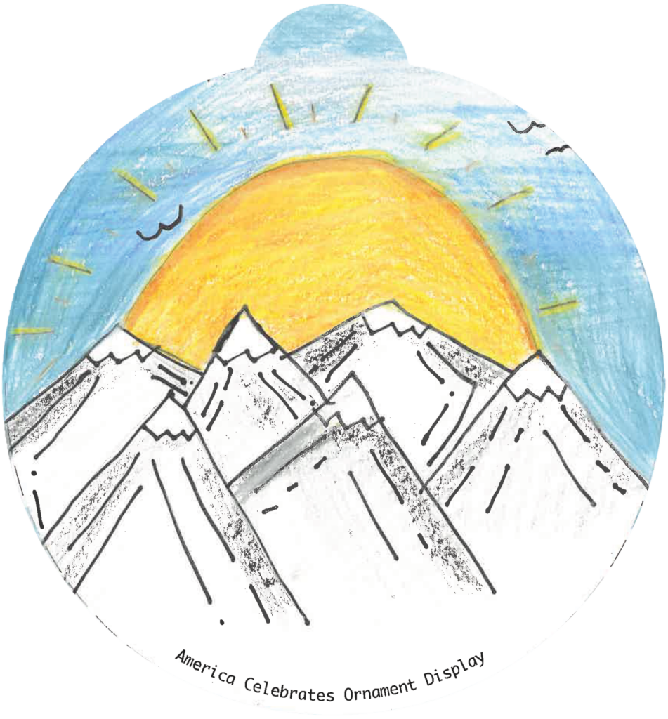 ornament depicting a sun rising over snow-capped mountains