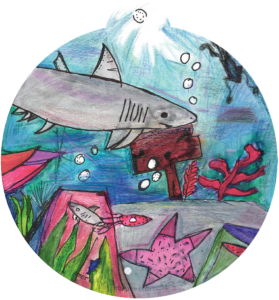 ornament depicting an underwater scene with a shark, starfish, and other fish