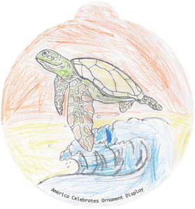 ornament depicting a sea turtle, a wave, and a sunset