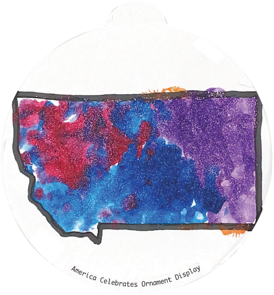ornament depicting the outline of the state of Montana, filled in with sparkly blue, red, and purple glitter