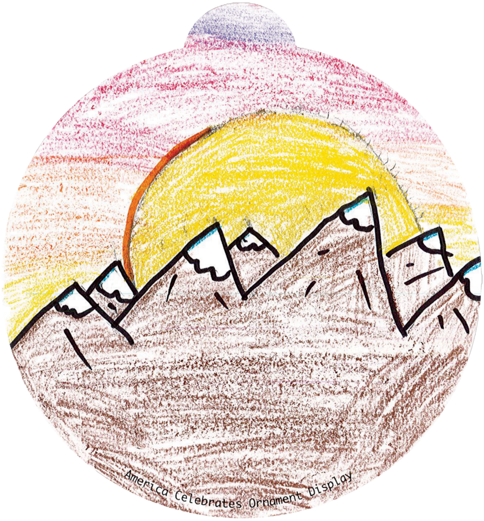 ornament depicting mountains against a sunrise