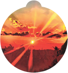 ornament depicting a sunrise over a field